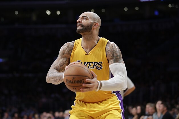 Los Angeles Lakers' Carlos Boozer looks to shoot during the second half of an NBA basketball game against the Utah Jazz, Thursday, March 19, 2015, in Los Angeles. The Jazz 80-73. (AP Photo/Jae C. Hong)