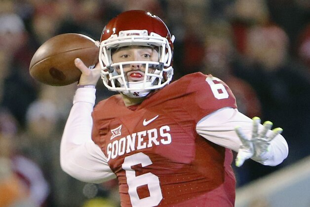 FILE - In this Nov. 21, 2015, file photo, Oklahoma quarterback Baker Mayfield (6) looks to pass against TCU during the first quarter of an NCAA college football game in Norman, Okla. Oklahoma quarterback Baker Mayfield is the unanimous pick as the Big 12 offensive player of the year and one of seven Sooners on The Associated Press All-Big 12 first team. (AP Photo/Alonzo Adams, File)