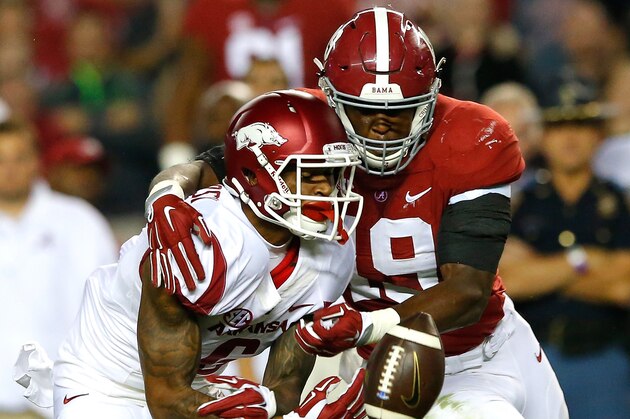 TUSCALOOSA, AL - OCTOBER 10:  Reggie Ragland #19 of the Alabama Crimson Tide breaks up this reception intended for Kendrick Edwards #6 of the Arkansas Razorbacks at Bryant-Denny Stadium on October 10, 2015 in Tuscaloosa, Alabama.  (Photo by Kevin C. Cox/Getty Images)