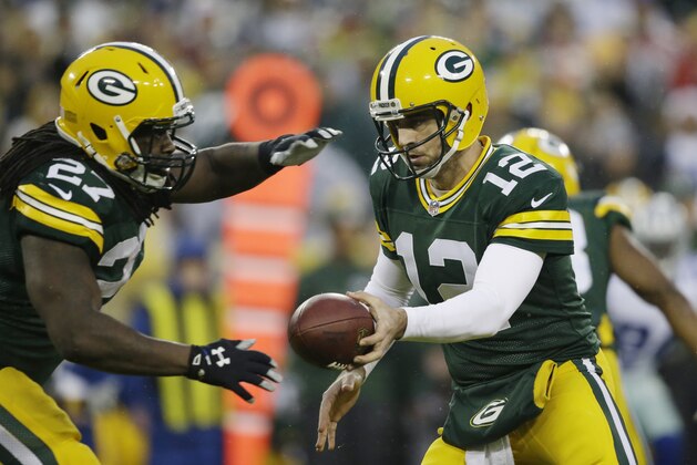 Green Bay Packers' Aaron Rodgers hands off to Eddie Lacy during the first half of an NFL football game against the Dallas Cowboys Sunday, Dec. 13, 2015, in Green Bay, Wis. (AP Photo/Jeffrey Phelps) Green Bay Packers' Aaron Rodgers hands off to Eddie Lacy during the first half of an NFL football game against the Dallas Cowboys Sunday, Dec. 13, 2015, in Green Bay, Wis. (AP Photo/Jeffrey Phelps)