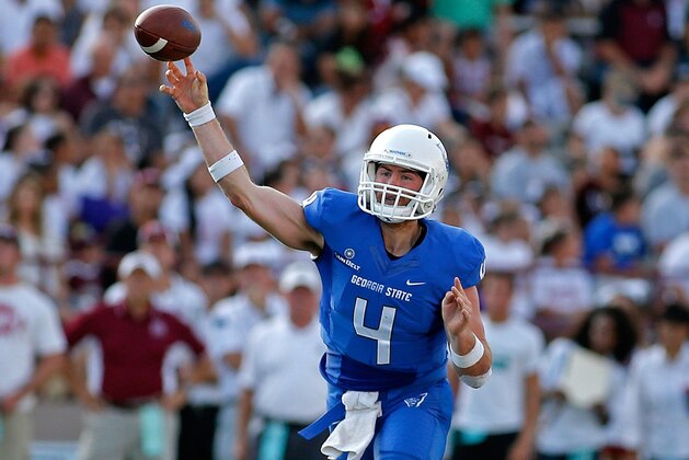 FILE - In this Sept. 12, 2015, file photo, Georgia State quarterback Nick Arbuckle throws during the first half of an NCAA college football game against New Mexico State in Las Cruces, N.M. Arbuckle surely had family and friends who wondered if he was thinking straight when he decided to play quarterback on the other side of the country, for a team coming off a winless season. Now, he'll be closing his career in Georgia State's first bowl game. (AP Photo/Andres Leighton, File)