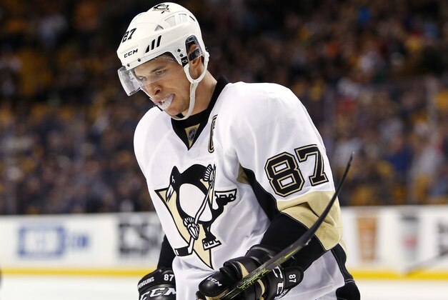 Pittsburgh Penguins' Sidney Crosby skates towards the bench during the third period of the Boston Bruins 3-0 win over the Pittsburgh Penguins in an NHL hockey game in Boston Wednesday, Dec. 16, 2015. (AP Photo/Winslow Townson)