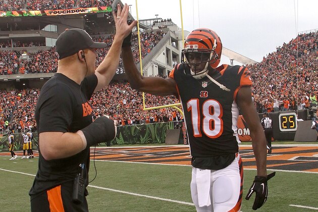 CINCINNATI, OH - DECEMBER 13:  Andy Dalton #14 of the Cincinnati Bengals congratulates A.J. Green #18 of the Cincinnati Bengals after scoring a touchdown during the second quarter of the game against the Pittsburgh Steelers at Paul Brown Stadium on December 13, 2015 in Cincinnati, Ohio. (Photo by John Grieshop/Getty Images)