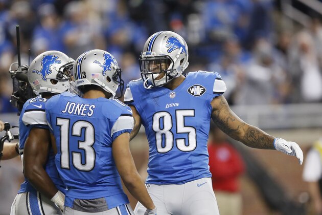 Detroit Lions tight end Eric Ebron (85) is congratulated after his touchdown by teammate wide receiver T.J. Jones (13) during the first half of an NFL football game against the Green Bay Packers, Thursday, Dec. 3, 2015, in Detroit. (AP Photo/Duane Burleson)