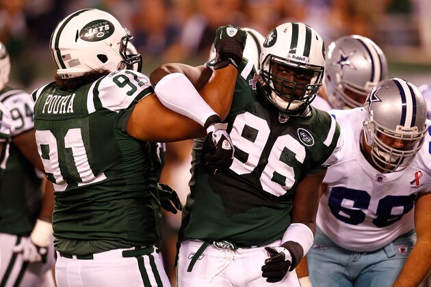 EAST RUTHERFORD, NJ - SEPTEMBER 11:  (L-R) Sione Pouha #91 and Muhammad Wilkerson #96 of the New York Jets celebrate after the Jets recorded a sack against the Dallas Cowboys during their NFL Season Opening Game at MetLife Stadium on September 11, 2011 in East Rutherford, New Jersey.  (Photo by Jeff Zelevansky/Getty Images)
