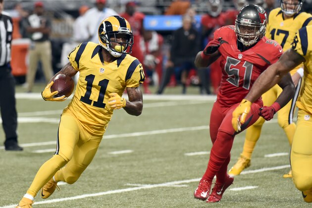 St. Louis Rams wide receiver Tavon Austin, left, runs past Tampa Bay Buccaneers outside linebacker Danny Lansanah (51) on a 21-yard touchdown during the third quarter of an NFL football game Thursday, Dec. 17, 2015, in St. Louis. (AP Photo/L.G. Patterson)