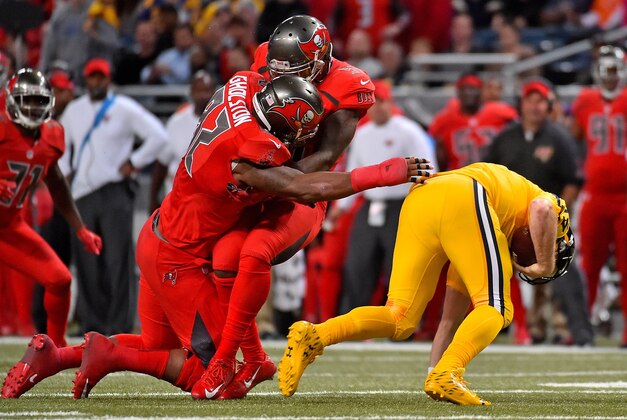 Dec 17, 2015; St. Louis, MO, USA; Tampa Bay Buccaneers defensive tackle Akeem Spence (97) and defensive end William Gholston (92) collide attempting to tackle St. Louis Rams quarterback Case Keenum (17) during the second half at the Edward Jones Dome. Mandatory Credit: Jasen Vinlove-USA TODAY Sports