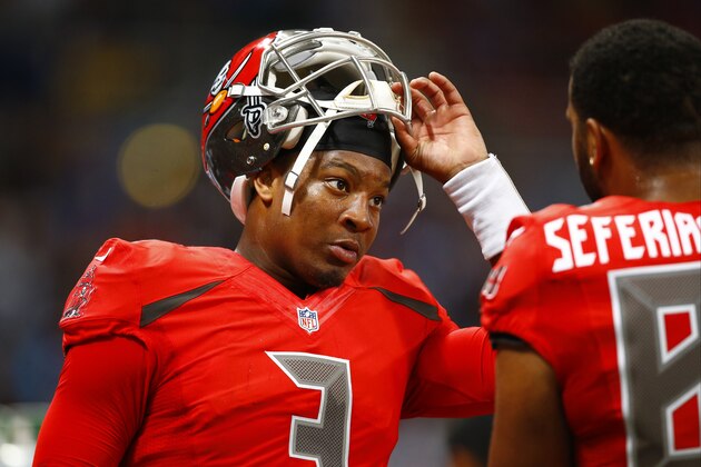 Tampa Bay Buccaneers quarterback Jameis Winston, left, talks on the sidelines with tight end Austin Seferian-Jenkins during the fourth quarter of an NFL football game on Thursday, Dec. 17, 2015, in St. Louis. (AP Photo/Billy Hurst)
