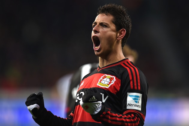 Leverkusen's Mexican striker Javier Hernandez celebrates after scoring his team's second goal during the German first division Bundesliga football match Bayer 04 Leverkusen vs Borussia Moenchengladbach in Leverkusen, western Germany, on December 12, 2015. AFP PHOTO / PATRIK STOLLARZ

RESTRICTIONS: DURING MATCH TIME: DFL RULES TO LIMIT THE ONLINE USAGE TO 15 PICTURES PER MATCH AND FORBID IMAGE SEQUENCES TO SIMULATE VIDEO. == RESTRICTED TO EDITORIAL USE == FOR FURTHER QUERIES PLEASE CONTACT DFL DIRECTLY AT + 49 69 650050. / AFP / PATRIK STOLLARZ        (Photo credit should read PATRIK STOLLARZ/AFP/Getty Images)
