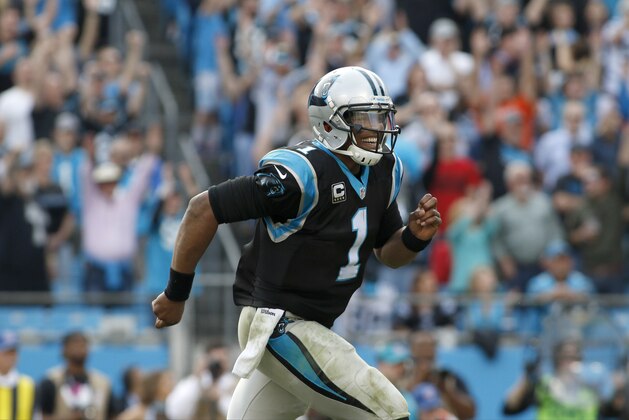 Carolina Panthers' Cam Newton (1) runs to the end zone celebration after a Panther touchdown against the Atlanta Falcons during the second half of an NFL football game in Charlotte, N.C., Sunday, Dec. 13, 2015.  The Carolina Panthers won 38-0.(AP Photo/Bob Leverone)