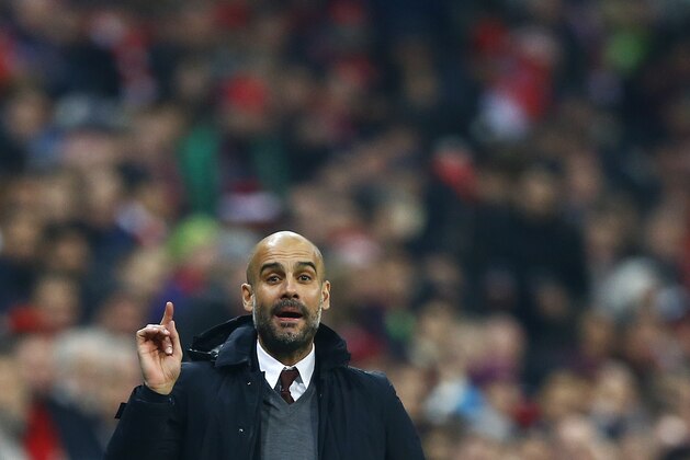 Bayern head coach pep Guardiola gestures during the German soccer cup (DFB Pokal) match between FC Bayern Munich and SV Darmstadt 98 at the Allianz Arena stadium in Munich, Germany, Tuesday, Dec. 15, 2015. (AP Photo/Matthias Schrader)