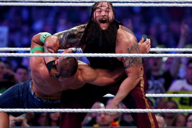 John Cena, left, and Bray Wyatt, right, compete during Wrestlemania XXX at the Mercedes-Benz Super Dome in New Orleans on Sunday, April 6, 2014. (Jonathan Bachman/AP Images for WWE)
