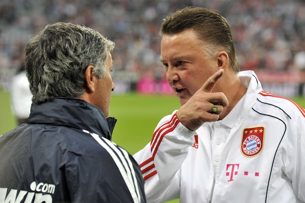 Munich's head coach Louis van Gaal, right, and Madrid's head coach Jose Mourinho  talk prior to their international friendly soccer match  between FC Bayern Munich and  Real Madrid in Munich, southern Germany, on Friday, Aug. 13, 2010. Fully 33 years later the farewell match will honor Franz Beckenbauer, who never received the honor when he left Munich to join the New York Cosmos, and later Hamburger SV. (AP Photo/Kerstin Joensson)