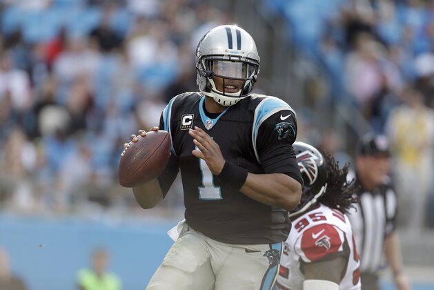 Carolina Panthers' Cam Newton (1) scrambles out of the pocket and looks tto throw as Atlanta Falcons' Jonathan Babineaux (95) chases during the first half of an NFL football game in Charlotte, N.C., Sunday, Dec. 13, 2015. The Carolina Panthers won 38-0. (AP Photo/Bob Leverone)