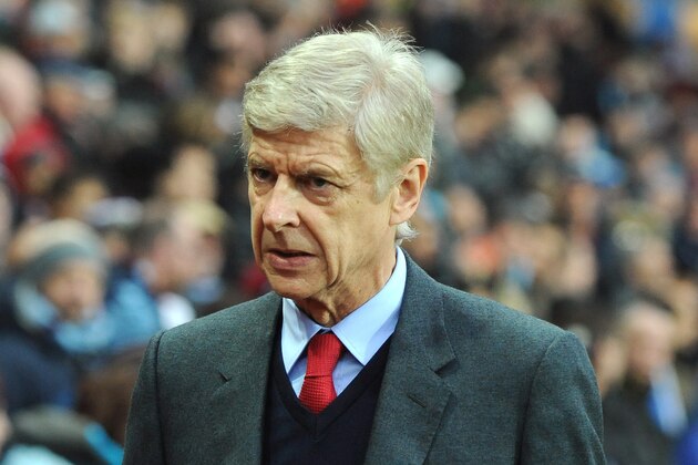 Arsenal manager Arsene Wenger looks on, during the English Premier League soccer match between Aston Villa and Arsenal at Villa Park in Birmingham, England, Sunday, Dec. 13, 2015. (AP Photo/Rui Vieira)