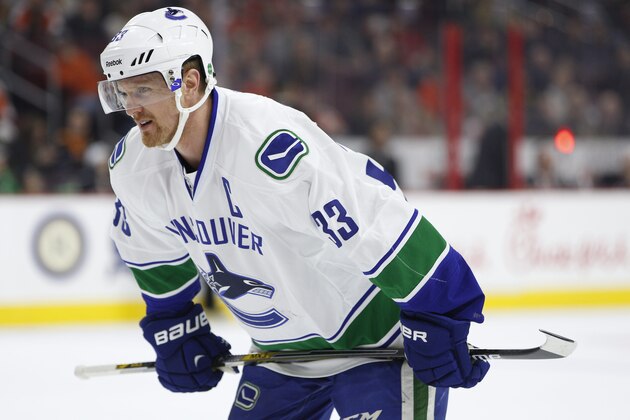 Vancouver Canucks center Henrik Sedin of Sweden looks on during the first period of an NHL hockey game against the Philadelphia Flyers, Thursday, Jan. 15, 2015, in Philadelphia. The Canucks won 4-0. (AP Photo/Chris Szagola)