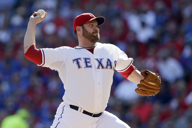 Texas Rangers starting pitcher Colby Lewis (48) throws to Toronto Blue Jays during the third inning in Game 4 of baseball's American League Division Series Monday, Oct. 12, 2015, in Arlington, Texas. (AP Photo/LM Otero)