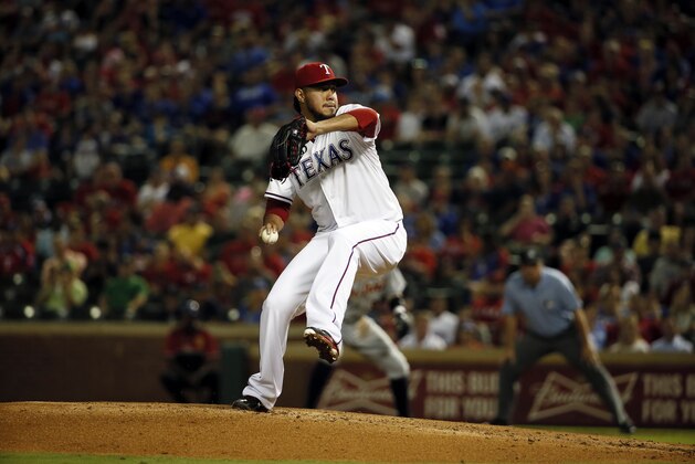 Texas Rangers starting pitcher Yovani Gallardo (49) works against the Detroit Tigers in the first inning of a baseball game Wednesday, Sept. 30, 2015, in Arlington, Texas. (AP Photo/Tony Gutierrez)
