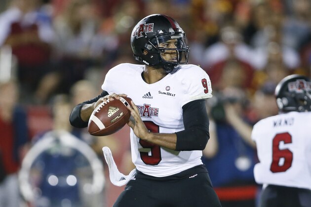 Arkansas State quarterback Fredi Knighten throws the ball against Southern California during the first half of an NCAA college football game, Saturday, Sept. 5, 2015, in Los Angeles. (AP Photo/Danny Moloshok)