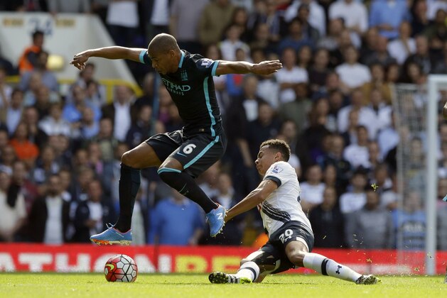 Tottenham Hotspur's Dele Alli, right, competes for the ball with Manchester City's Fernando during the English Premier League soccer match between Tottenham Hotspur and Manchester City at White Hart Lane stadium in London, Saturday, Sept. 26, 2015.  (AP Photo/Matt Dunham)