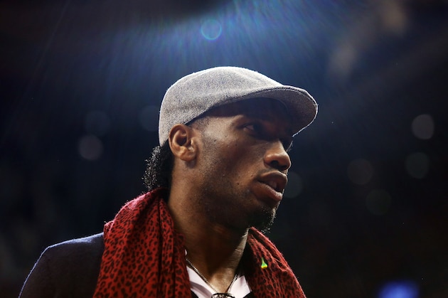 TORONTO, ON - DECEMBER 05:  Footballer Didier Drogba looks on from courtside during an NBA game between the Golden State Warriors and the Toronto Raptors at the Air Canada Centre on December 05, 2015 in Toronto, Ontario, Canada.  NOTE TO USER: User expressly acknowledges and agrees that, by downloading and or using this photograph, User is consenting to the terms and conditions of the Getty Images License Agreement.  (Photo by Vaughn Ridley/Getty Images)