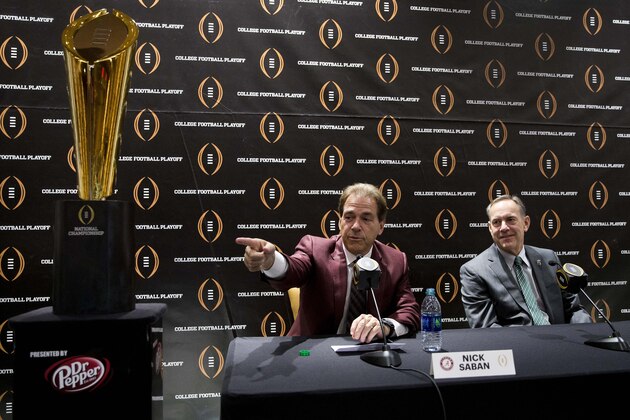 Alabama head football coach Nick Saban, left, gestures as Michigan St. head coach Mark Dontonio looks on during a new conference before the college football awards at the College Football Hall of Fame  Thursday, Dec. 10, 2015, in Atlanta.  Alabama and Michigan St will play in the Cotton Bowl. (AP Photo/John Bazemore)