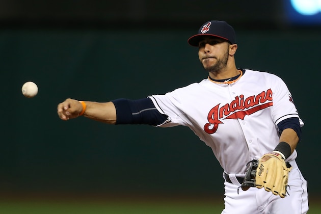 Cleveland Indians' Mike Aviles throws out Seattle Mariners Robinson Cano during the seventh inning of a baseball game, Tuesday, June 9, 2015, in Cleveland. (AP Photo/Ron Schwane)
