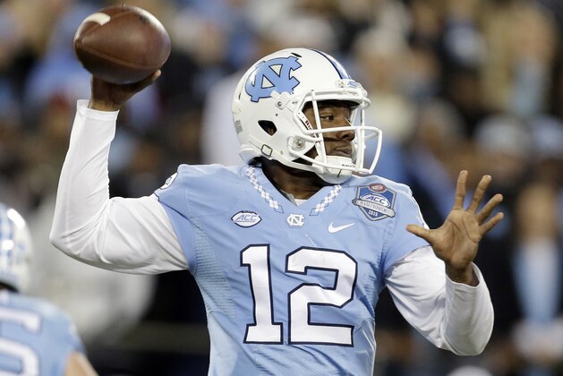 North Carolina quarterback Marquise Williams passes during the first half of the Atlantic Coast Conference championship NCAA college football game against Clemson in Charlotte, N.C., Saturday, Dec. 5, 2015. (AP Photo/Bob Leverone)