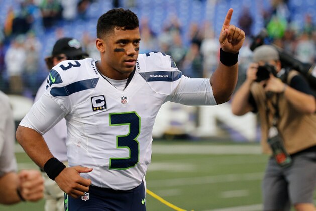 BALTIMORE, MD - DECEMBER 13: Quarterback Russell Wilson #3 of the Seattle Seahawks runs off the field after defeating the Baltimore Ravens 35-6 at M&T Bank Stadium on December 13, 2015 in Baltimore, Maryland. (Photo by Rob Carr/Getty Images)