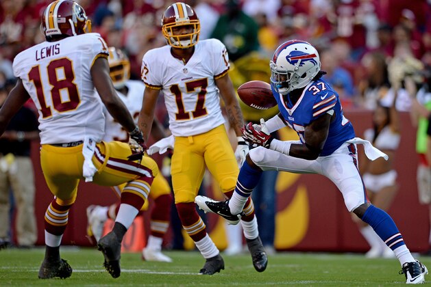 LANDOVER, MD - AUGUST 24: Nickell Robey #37 of the Buffalo Bills fumbles a punt return in front of Lance Lewis #18 of the Washington Redskins and teammate Chip Reeves #17 in the third quarter during a preseason game at FedExField on August 24, 2013 in Landover, Maryland. The Washington Redskins won, 30-7. (Photo by Patrick Smith/Getty Images)