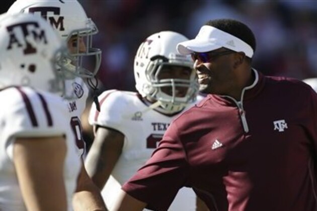 Texas A&M coach Kevin Sumlin talks with his players prior to the start of an NCAA college football game against Alabama at Bryant-Denny Stadium in Tuscaloosa, Ala., Saturday, Nov. 10, 2012. (AP Photo/Dave Martin)