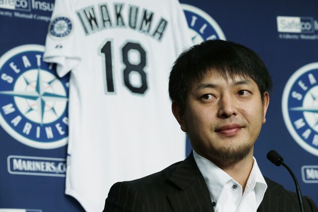 Seattle Mariners pitcher Hisashi Iwakuma listens to a question as he talks to reporters, Friday, Dec. 18, 2015, in Seattle. Iwakuma, who has been with the Mariners since 2012, signed a new one-year contract with the team for the 2016 season. (AP Photo/Ted S. Warren)