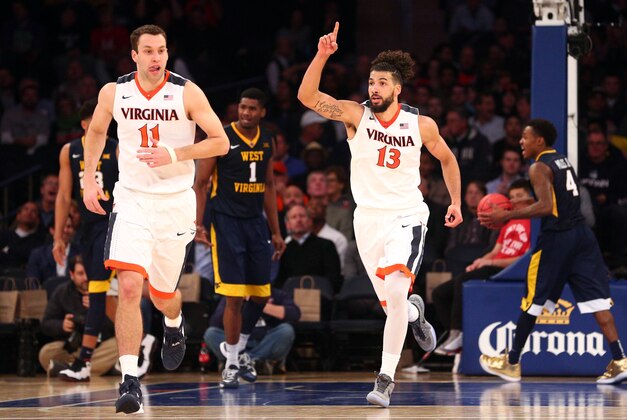 Dec 8, 2015; New York, NY, USA; Virginia Cavaliers forward Anthony Gill (13) reacts after making a shot against the West Virginia Mountaineers during the second half of the first game of the Jimmy V Classic at Madison Square Garden. Virginia defeated West Virginia 70-54. Mandatory Credit: Brad Penner-USA TODAY Sports