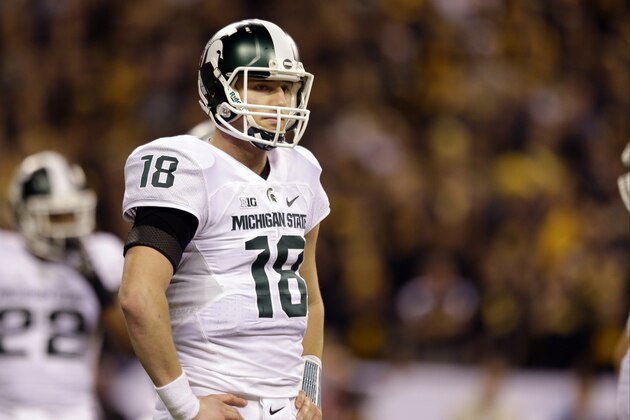 Michigan State quarterback Connor Cook (18) looks to the sideline during the first half of the Big Ten Conference championship NCAA college football game against Iowa Saturday, Dec. 5, 2015, in Indianapolis. (AP Photo/Michael Conroy)