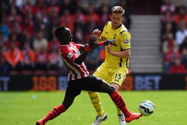 SOUTHAMPTON, ENGLAND - APRIL 25: Sadio Mane of Southampton tackles Eric Dier of Spurs during the Barclays Premier League match between Southampton and Tottenham Hotspur at St Mary's Stadium on April 25, 2015 in Southampton, England.  (Photo by Mike Hewitt/Getty Images)