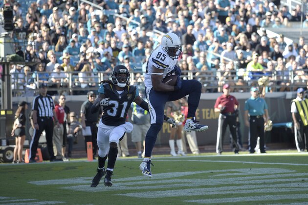 San Diego Chargers tight end Antonio Gates (85) catches a pass in the end zone for a touchdown in front of Jacksonville Jaguars cornerback Davon House (31) during the first half of an NFL football game in Jacksonville, Fla., Sunday, Nov. 29, 2015. (AP Photo/Phelan M. Ebenhack)