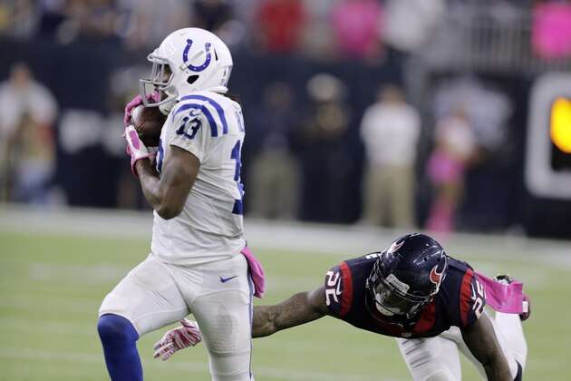 Indianapolis Colts' T.Y. Hilton makes a 43-yard catch over Houston Texans' Kareem Jackson (25) during the second half of an NFL football game Thursday, Oct. 8, 2015, in Houston. (AP Photo/Patric Schneider)