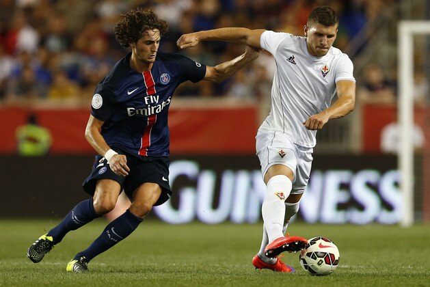 Fiorentina forward Ante Rebic, right is chased by Paris Saint-Germain midfielder Adrien Rabiot (25) in the second half during a soccer match in the International Champions Cup in Harrison N.J., Tuesday, July 21, 2015. Paris Saint-Germain won 4-2. (AP Photo/Rich Schultz)