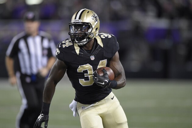 New Orleans Saints running back Tim Hightower (34) runs with the ball against the Baltimore Ravens during an NFL preseason football game, Thursday, Aug. 13, 2015, in Baltimore. (AP Photo/Nick Wass)