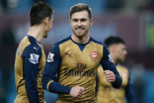 Arsenal's Welsh midfielder Aaron Ramsey (C) reacts following the English Premier League football match between Aston Villa and Arsenal at Villa Park in Birmingham, central England on December 13, 2015. Arsenal won the match 2-1. AFP PHOTO / ADRIAN DENNIS
RESTRICTED TO EDITORIAL USE. No use with unauthorized audio, video, data, fixture lists, club/league logos or 'live' services. Online in-match use limited to 75 images, no video emulation. No use in betting, games or single club/league/player publications. / AFP / ADRIAN DENNIS (Photo credit should read ADRIAN DENNIS/AFP/Getty Images) Arsenal's Welsh midfielder Aaron Ramsey (C) reacts following the English Premier League football match between Aston Villa and Arsenal at Villa Park in Birmingham, central England on December 13, 2015. Arsenal won the match 2-1. AFP PHOTO / ADRIAN DENNIS
RESTRICTED TO EDITORIAL USE. No use with unauthorized audio, video, data, fixture lists, club/league logos or 'live' services. Online in-match use limited to 75 images, no video emulation. No use in betting, games or single club/league/player publications. / AFP / ADRIAN DENNIS (Photo credit should read ADRIAN DENNIS/AFP/Getty Images)