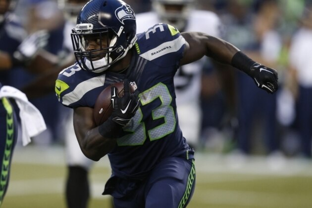 Seattle Seahawks running back Christine Michael runs the ball against the Oakland Raiders in the first half of a preseason NFL football game, Thursday, Sept. 3, 2015, in Seattle. (AP Photo/Stephen Brashear)