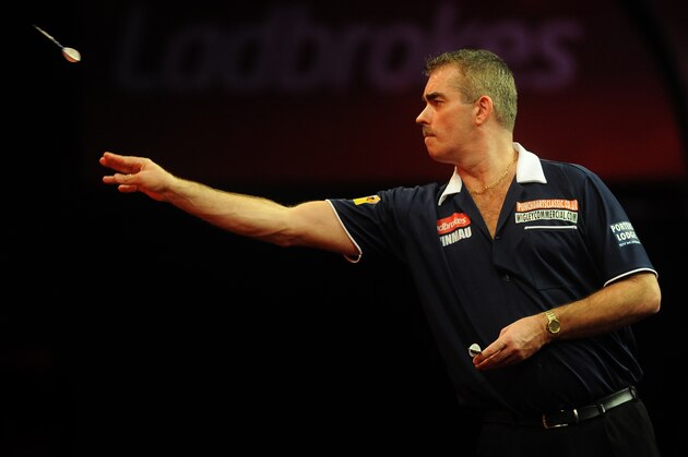 LONDON, ENGLAND - DECEMBER 23: Steve Beaton of England in action during his second round match against James Wade of England on day Ten of the Ladbrokes.com World Darts Championship at Alexandra Palace on December 23, 2012 in London, England. (Photo by Charlie Crowhurst/Getty Images)