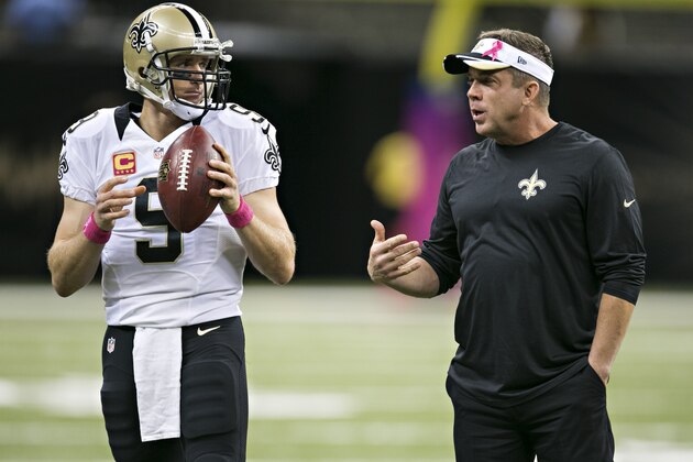 NEW ORLEANS, LA - OCTOBER 5:  Head Coach Sean Payton and Drew Brees #9 of the New Orleans Saints talk before a game against the Tampa Bay Buccaneers at Mercedes-Benz Superdome on October 5, 2014 in New Orleans, Louisiana.  The Saints defeated the Buccaneers 37-31.  (Photo by Wesley Hitt/Getty Images)