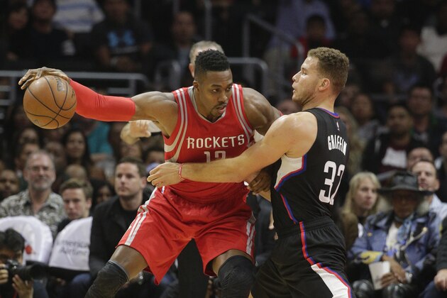 Houston Rockets' Dwight Howard, left, is pressured by Los Angeles Clippers' Blake Griffin during the first half of an NBA basketball game, Saturday, Nov. 7, 2015, in Los Angeles. (AP Photo/Jae C. Hong)