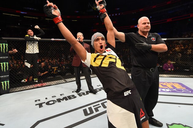 ORLANDO, FL - DECEMBER 19:   Charles Oliveira celebrates his submission victory over Myles Jury in their featherweight bout during the UFC Fight Night event at the Amway Center on December 19, 2015 in Orlando, Florida. (Photo by Josh Hedges/Zuffa LLC/Zuffa LLC via Getty Images)