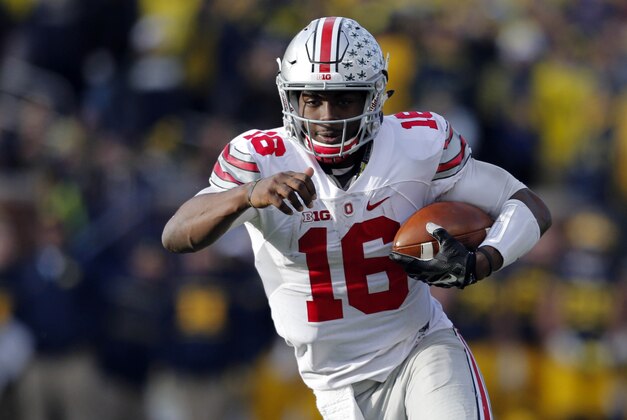 Nov 28, 2015; Ann Arbor, MI, USA; Ohio State Buckeyes quarterback J.T. Barrett (16) rushes in the second half against the Ohio State Buckeyes at Michigan Stadium. Ohio State won 42-13. Mandatory Credit: Rick Osentoski-USA TODAY Sports