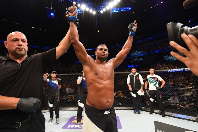 ORLANDO, FL - DECEMBER 19:   Alistair Overeem celebrates his TKO victory over Junior dos Santos in their heavyweight bout during the UFC Fight Night event at the Amway Center on December 19, 2015 in Orlando, Florida. (Photo by Josh Hedges/Zuffa LLC/Zuffa LLC via Getty Images)