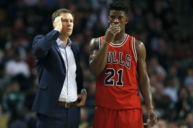 Chicago Bulls head coach Fred Hoiberg, left, talks with Jimmy Butler (21)  during the second half of an NBA basketball game against the Boston Celtics in Boston, Wednesday, Dec. 9, 2015. The Celtics won 105-100. (AP Photo/Michael Dwyer)