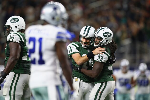 ARLINGTON, TX - DECEMBER 19:   Ryan Fitzpatrick #14 and Chris Ivory #33 of the New York Jets celebrates a touchdown against the Dallas Cowboys in the fourth quarter at AT&T Stadium on December 19, 2015 in Arlington, Texas.  (Photo by Ronald Martinez/Getty Images)