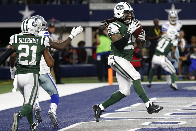 New York Jets free safety Marcus Gilchrist (21) watches as strong safety Calvin Pryor (25) intercepts a pass intended for Dallas Cowboys' Dez Bryant, left rear, in the second half of an NFL football game, Saturday, Dec. 19, 2015, in Arlington, Texas. (AP Photo/Brandon Wade)